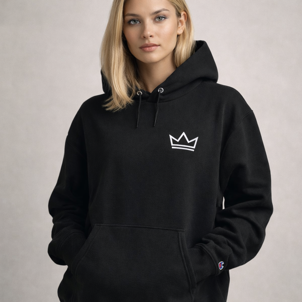 Female model wearing women's black minimalist streetwear PurposeDriven crown hoodie