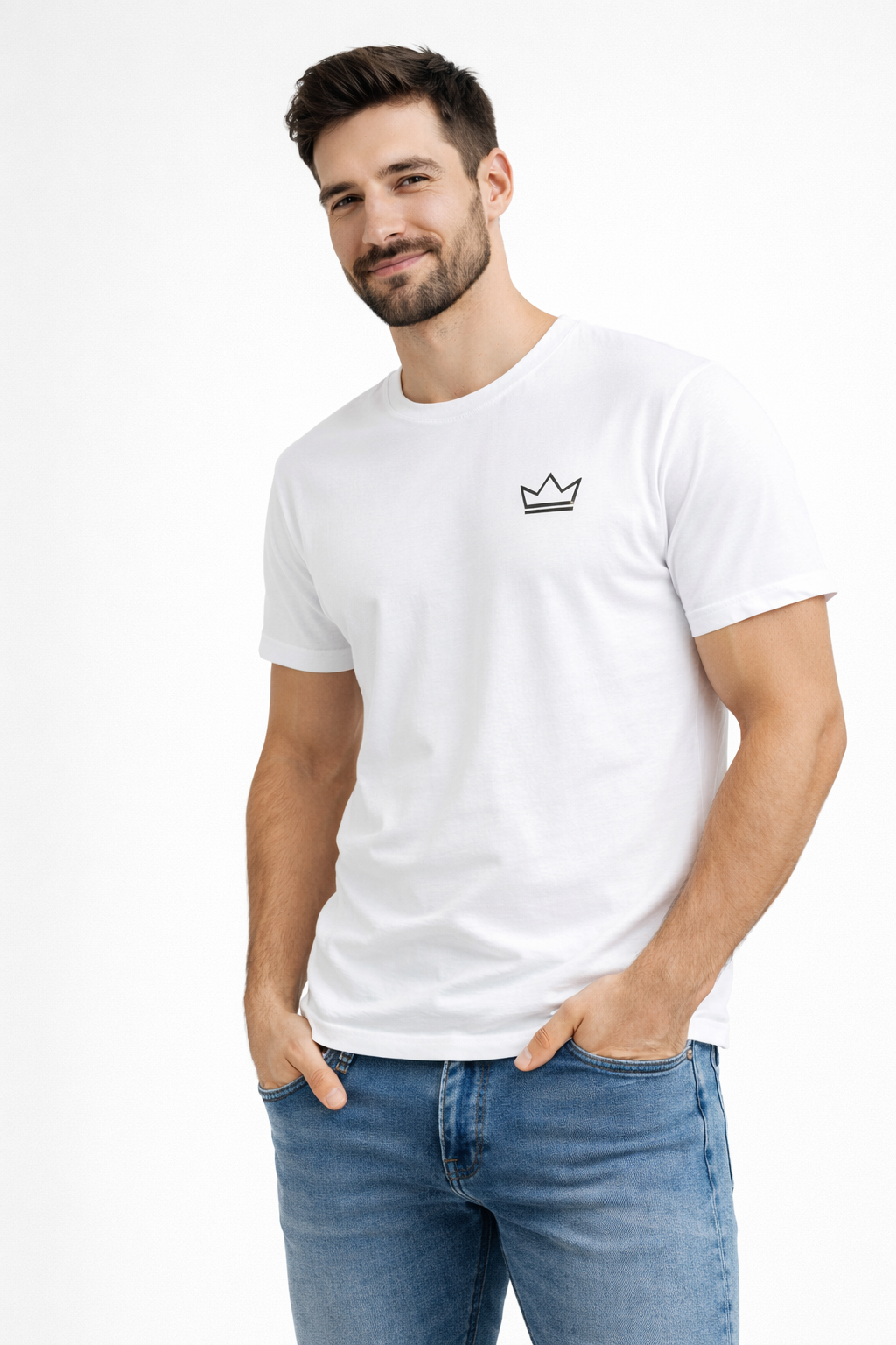 White minimalist men’s t-shirt with small black crown logo, worn by male model in jeans against a clean white background