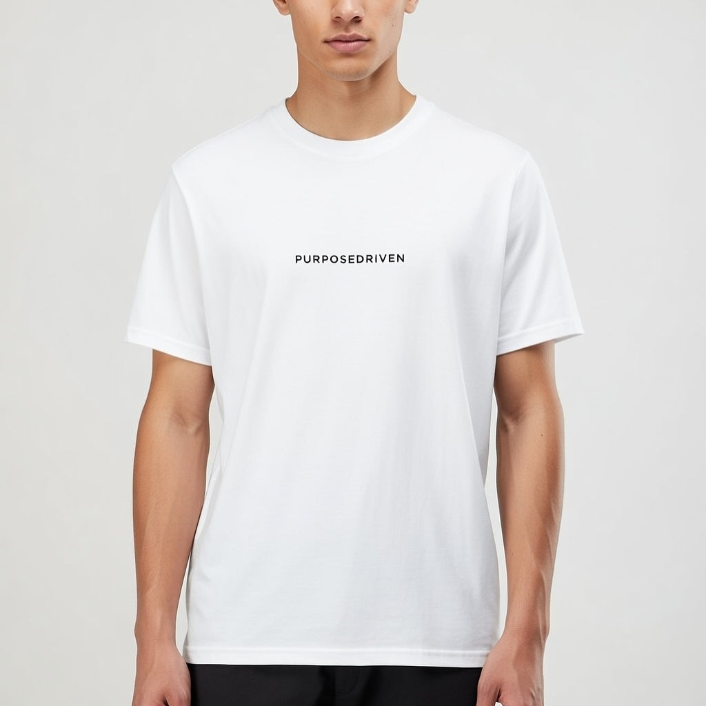 Male model wearing white PurposeDriven minimalist t-shirt, premium motivational streetwear on neutral studio background